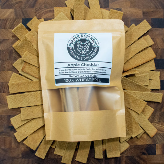 Wheat-free dog treats combining BC apples and aged cheddar for a tasty reward.